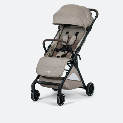 A tan stroller with a brown bumper bar, a canopy, a storage basket, and the Britax logo on the leg rest.