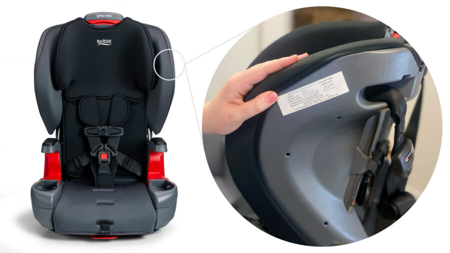 Hand pointing to the serial label on the outside of the headrest on a harness-2-booster seat.