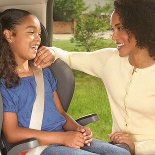 Mother checking car seat fit lifestyle child in grow with you