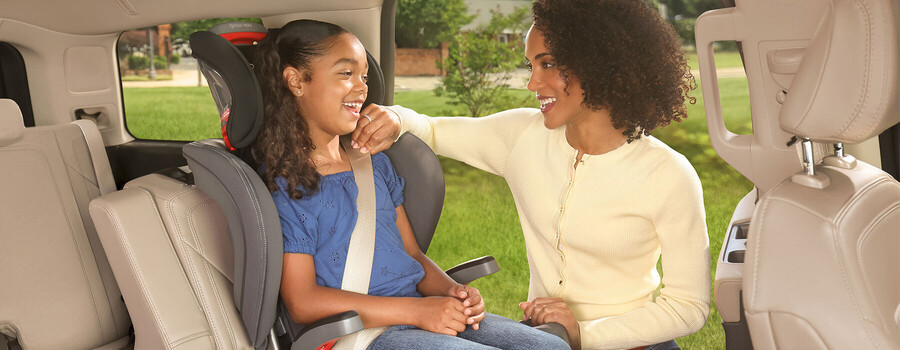 Mother checking car seat fit lifestyle child in grow with you