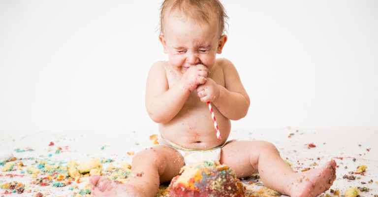 Baby eating cake