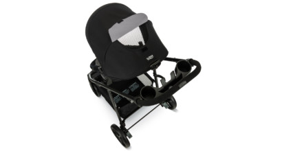Top view of toddler and baby stroller, showing the extended canopy, mesh window, and parent tray with cup holders.