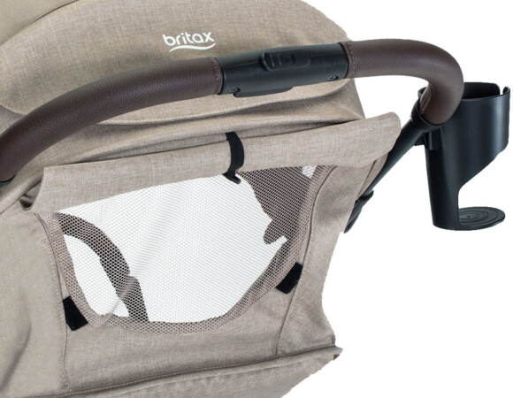 The back side of a stroller with a mesh panel.