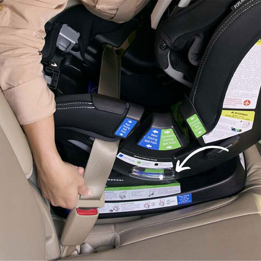A white arrow pointing to the recline indicator on a rear-facing car seat. 