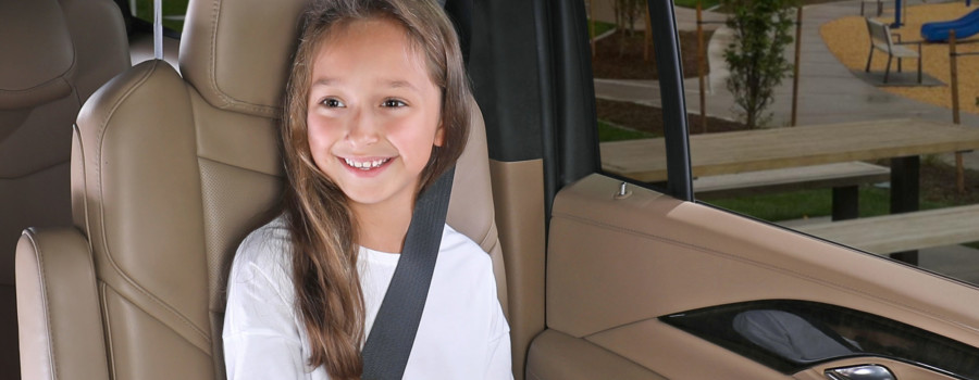 Girl sitting in Highpoint booster in backless mode