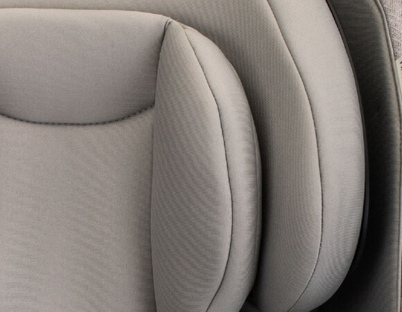 Black, teal, grey, and tan child car seats.