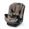 A greige rotating convertible car seat with two cup holders and a 5-point harness.